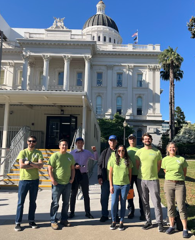 Group of CAPS-UAW members standing in front of the California State Capitol.